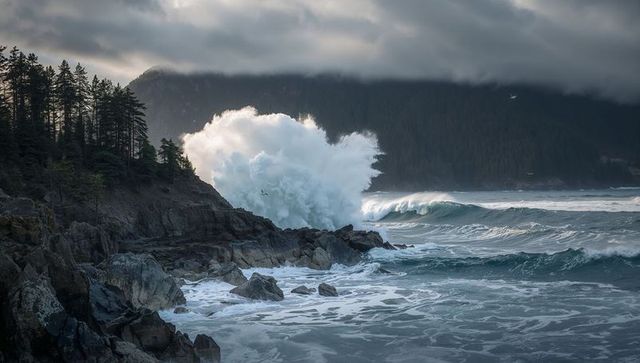 Dramatic Ocean Wave Crashing Against Rocky Coastline