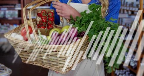 Woman holding picnic basket with fresh organic produce