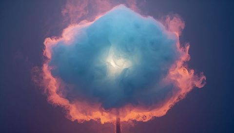 Luminous smoke bloom glowing blue core with fiery orange rim hovering on thin stem