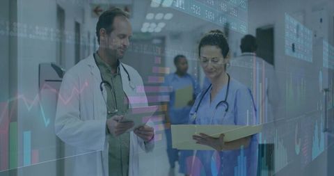 Doctor and nurse reviewing clinical data with analytics overlay and charts in hospital