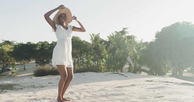 Young Woman Enjoying Summer Day at Beach Wearing Sun Hat - Download Free Stock Images Pikwizard.com