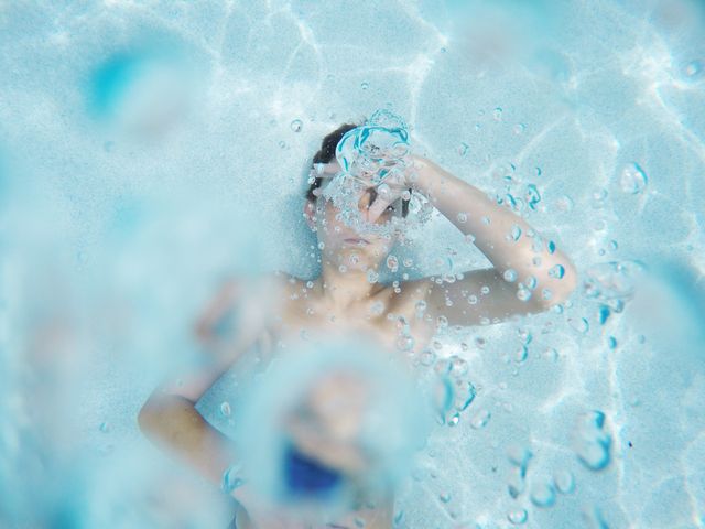 Person Relaxing Underwater with Bubbling Water - Download Free Stock Photos Pikwizard.com
