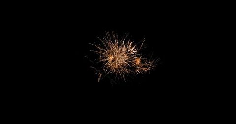 Orange Fireworks Display in Night Sky Explosion