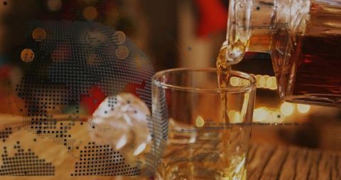 Decanter pouring whiskey into lowball glass on wooden bar with halftone globe overlay, golden hour a