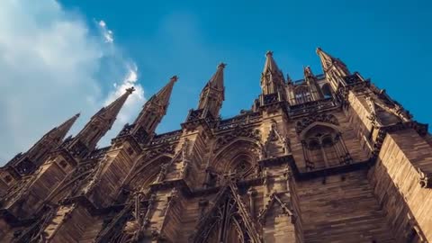Upward View of Medieval Gothic Cathedral with Spires
