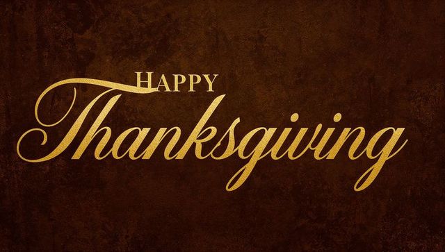 Elegant gold happy thanksgiving calligraphy on vintage brown textured background
