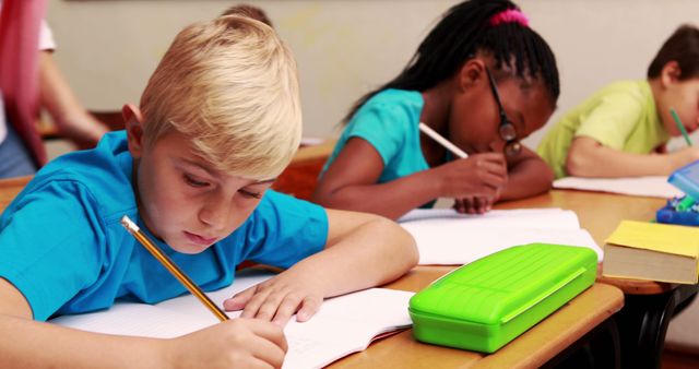 Diverse Group of Children Focused on Classroom Activity - Download Free Stock Images Pikwizard.com