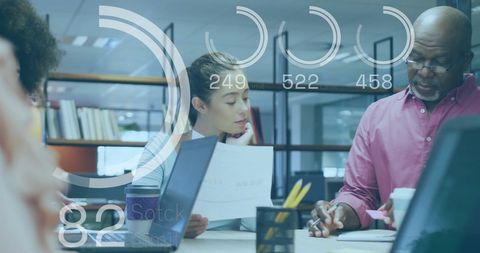 Team collaborating on financial data in modern office environment