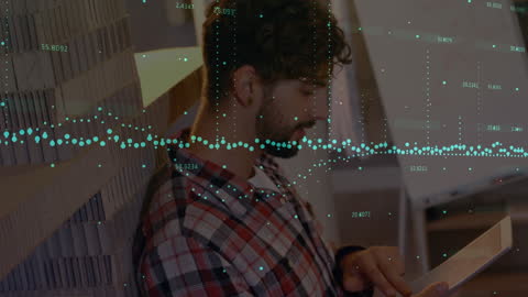 Businessman Reading Financial Data on Tablet