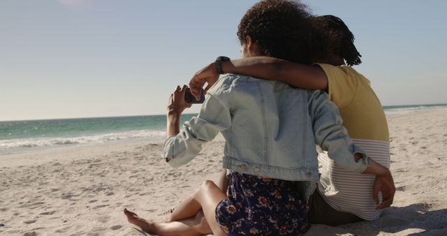 Two Friends Relaxing on Sandy Beach Taking Photos - Download Free Stock Images Pikwizard.com