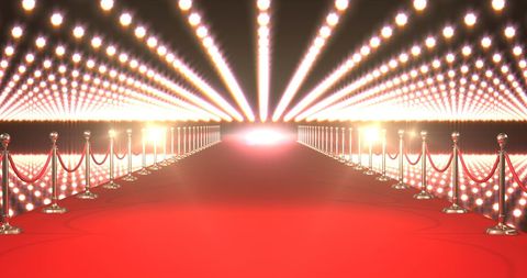 Elegant red carpet entrance with dazzling spotlights