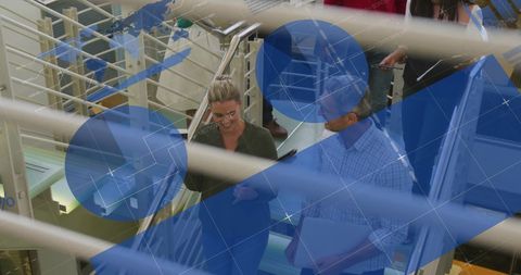 Colleagues Collaborating on Office Stairs with Infographic Overlay