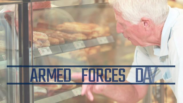 Elderly man stands behind a bakery display case, selecting various pastries while 'Armed Forces Day' is prominently displayed. This video is perfect for content about annual celebrations, honoring veterans, bakery promotions, senior lifestyle, and community events.