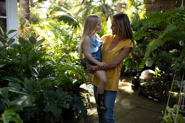Mother and Daughter Smiling in Sunny Garden - Download Free Stock Images Pikwizard.com