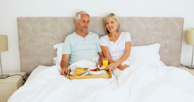 Senior Couple Enjoying Breakfast in Bed, Relaxing Morning Together - Download Free Stock Images Pikwizard.com