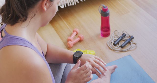 Woman Checking Fitness App After Home Workout Session - Download Free Stock Images Pikwizard.com