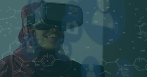 Woman Using VR Headset with Digital Chemical Formulas