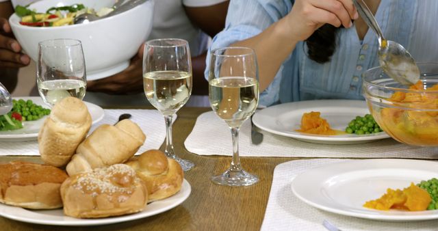 Friends Enjoying Festive Dinner with Wine and Fresh Bread - Download Free Stock Images Pikwizard.com