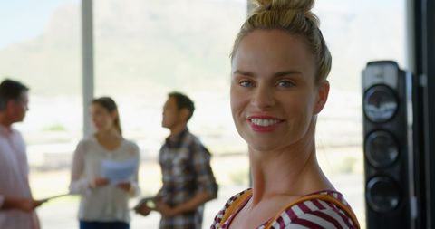 Positive Female Business Executive in Modern Office Environment