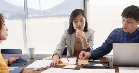 Diverse Team Collaborating on Fashion Design Ideas