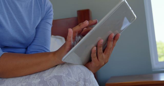 Person Sitting in Bed Using Digital Tablet - Download Free Stock Images Pikwizard.com