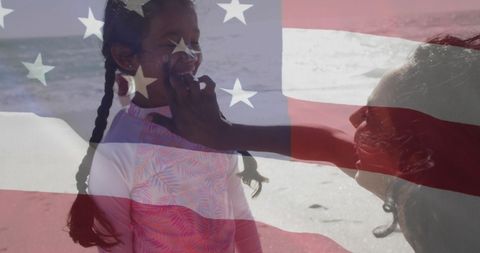 Patriotism and Family: American Flag Uniting Mother and Daughter at Beach - Download Free Stock Images Pikwizard.com