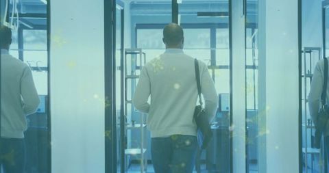 Business professional walking in modern office corridor