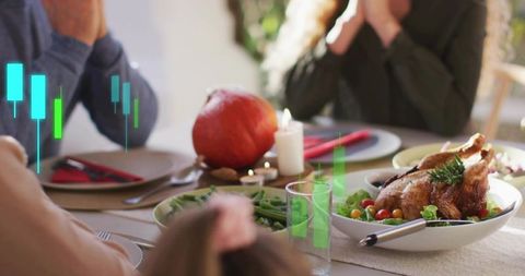 Family Holding Hands Before Holiday Feast with Roasted Turkey and Market Data Overlay