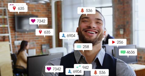 Businessman Surrounded by Social Media Icons in Modern Office