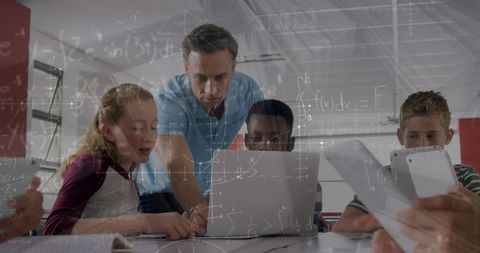 Teacher Guiding Students with Technology and Math Integration - Download Free Stock Images Pikwizard.com