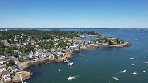 Aerial view of coastal town with boats on a sunny day