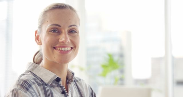 Smiling Professional Woman in Modern Office with Window View - Download Free Stock Images Pikwizard.com