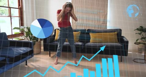 Young woman wearing headphones interacting with augmented reality charts and data at home