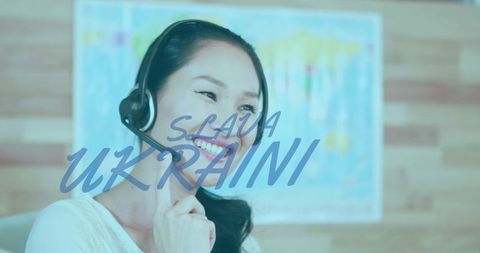 Businesswoman Using headset with Text Overlay Supporting Ukraine