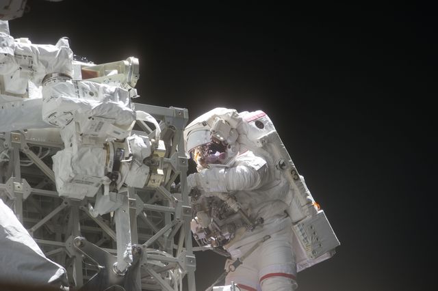 S134-E-009077 (25 May 2011) --- With his Extravehicular Mobility Unit spacesuit backdropped against the blackness of space,  NASA astronaut  Andrew Feustel is pictured during the STS-134 mission?s third spacewalk (Feustel?s third for the mission and sixth overall in his career). Astronauts Feustel and Michael Fincke (out of frame), both mission specialists, coordinated their shared activity with NASA astronaut Greg Chamitoff (out of frame), who stayed in communication with the pair and with Mission Control Center in Houston from the shirt sleeve environment inside the ISS. Photo credit: NASA