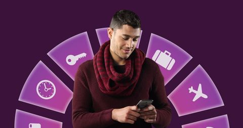 Man engaging with smartphone amid digital travel icons