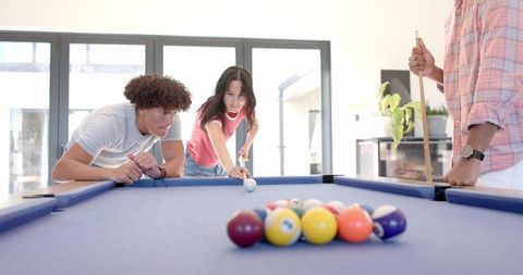 Friends Playing Billiards at Home Relaxing Hanging Out