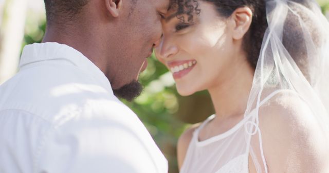 Close up of happy married african american couple smiling. Wedding day, marriage and celebration concept.