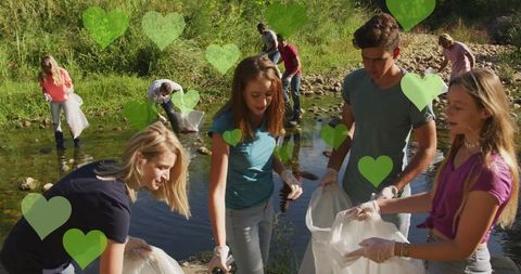 Community Volunteers Engaged in River Cleanup with Eco Signifiers - Download Free Stock Images Pikwizard.com