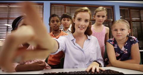 Teacher Helping Group of Students on Computer in Classroom - Download Free Stock Images Pikwizard.com