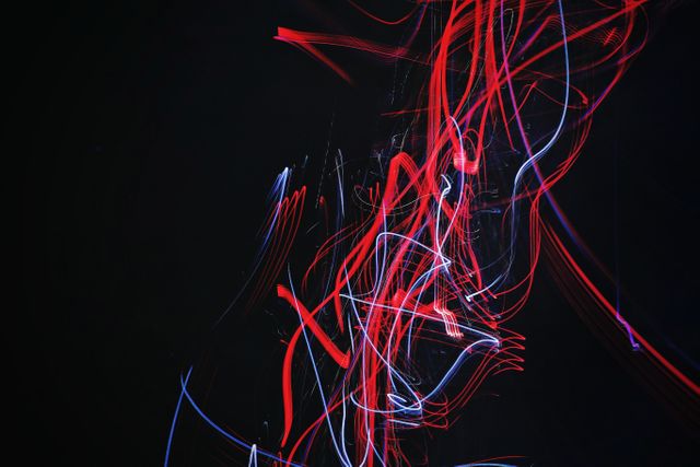 Abstract Light Trails in Dark Background with Red and Blue Streaks - Download Free Stock Photos Pikwizard.com