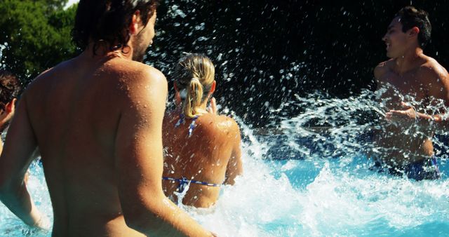 Friends Having Fun Splashing Water in Pool on Sunny Day - Download Free Stock Images Pikwizard.com