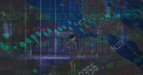 Businesswoman observing financial data overlays