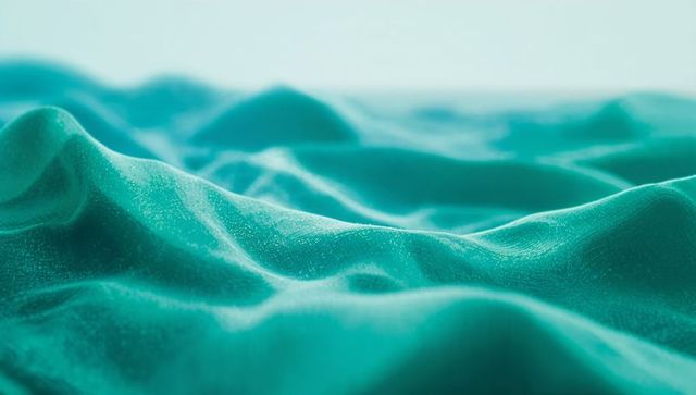 Teal Fabric with Undulating Waves and Soft Sheen