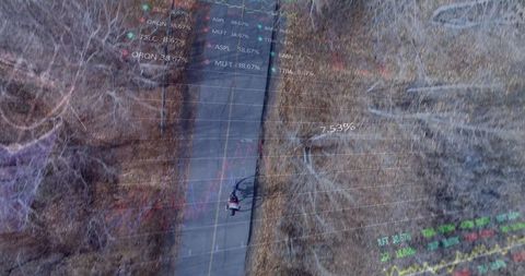 Abstract Overlay of Graphs and Bicyclist on Road