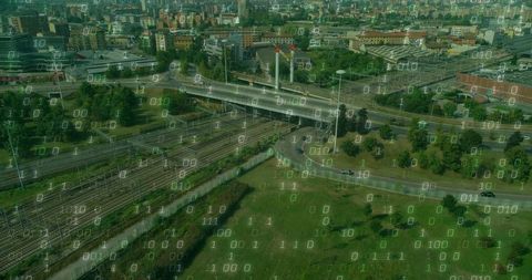 Aerial view of railroad and highway network with binary overlay