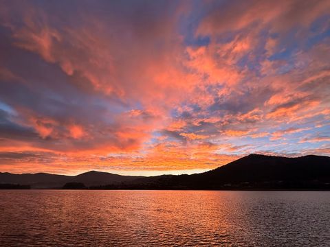 Vibrant orange and purple sunset over beach