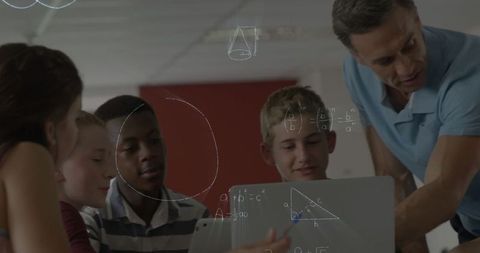 teacher assisting students with mathematics on laptop in classroom - Download Free Stock Images Pikwizard.com