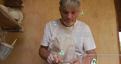 Skilled potter shaping clay with carving tool in rustic studio, artisan craft HUD overlay