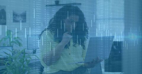 Focused professional analyzing data in futuristic office design